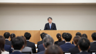 Bank of Japan Governor Kazuo Ueda speaks at a securities conference in Tokyo.