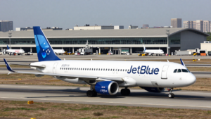 A JetBlue passenger jet taxis at LaGuardia Airport near the Marine Air Terminal.