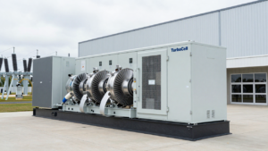 Modular turbine generator beside a data-center building.