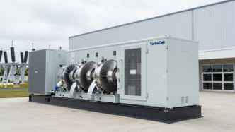 Modular turbine generator beside a data-center building.