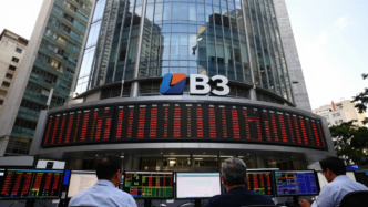 Traders review market screens near the B3 exchange in São Paulo after the Ibovespa declined.