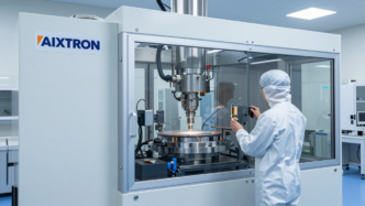 Semiconductor deposition equipment inside a cleanroom at an AIXTRON manufacturing facility.