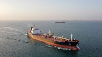 Oil tanker underway in Gulf waters near Qatar amid heightened shipping security concerns.