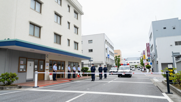 Japanese police outside a hotel in Naha, Okinawa, after a woman’s death.