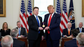 Donald Trump presents a science medal to Elon Musk at a White House ceremony.