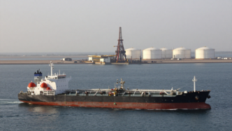 Oil tanker passing near Gulf export infrastructure in the Strait of Hormuz
