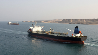 Oil tankers transit the Strait of Hormuz near Oman's coast.