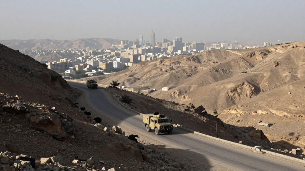 Military vehicles on a rugged road in Yemen’s northern highlands.