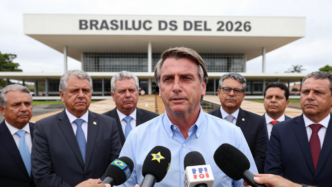 Flávio Bolsonaro speaks to reporters in Brasília ahead of Brazil’s presidential runoff.