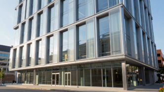 Modern commercial building showcasing glass, metal framing and translucent architectural panels