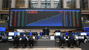 Frankfurt trading hall with an electronic display showing the DAX up 0.82%.