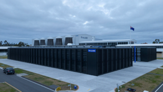 Modern data-centre buildings and cooling infrastructure representing Firmus Grid’s expansion.