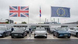 New electric and hybrid cars on a British dealership forecourt amid UK-EU automotive trade tensions.