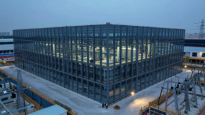 A large data center under construction, illustrating the infrastructure investment behind the AI buildout.
