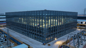 A large data center under construction, illustrating the infrastructure investment behind the AI buildout.