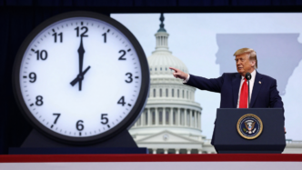 Donald Trump speaks at a rally beside a clock graphic, illustrating the dispute over permanent daylight saving time.