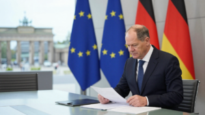 Friedrich Merz in a Berlin government meeting room with German and EU flags